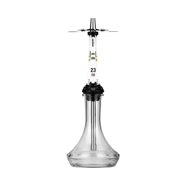 A modern glass hookah with a clear glass base, a white central stem, and black accents, including a black mouthpiece with three prongs and a black collar. The stem features the brand name 'KAVU' and the number '23'.